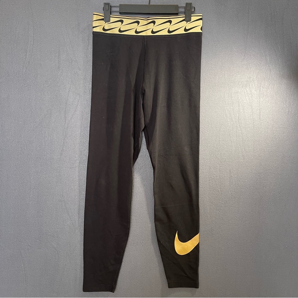 Nike Women's Black Leggings with Gold Accents Size Medium